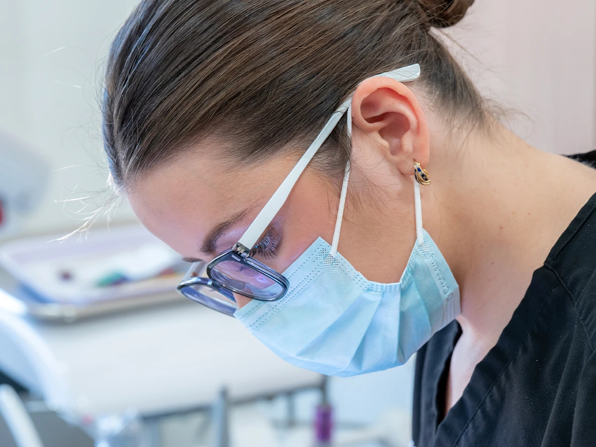 A patient receiving a gentle dental cleaning