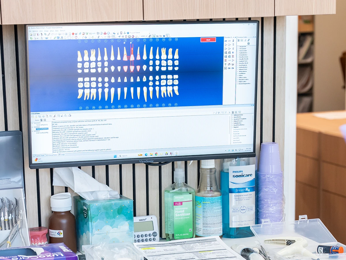 A chairside monitor displaying dental imaging